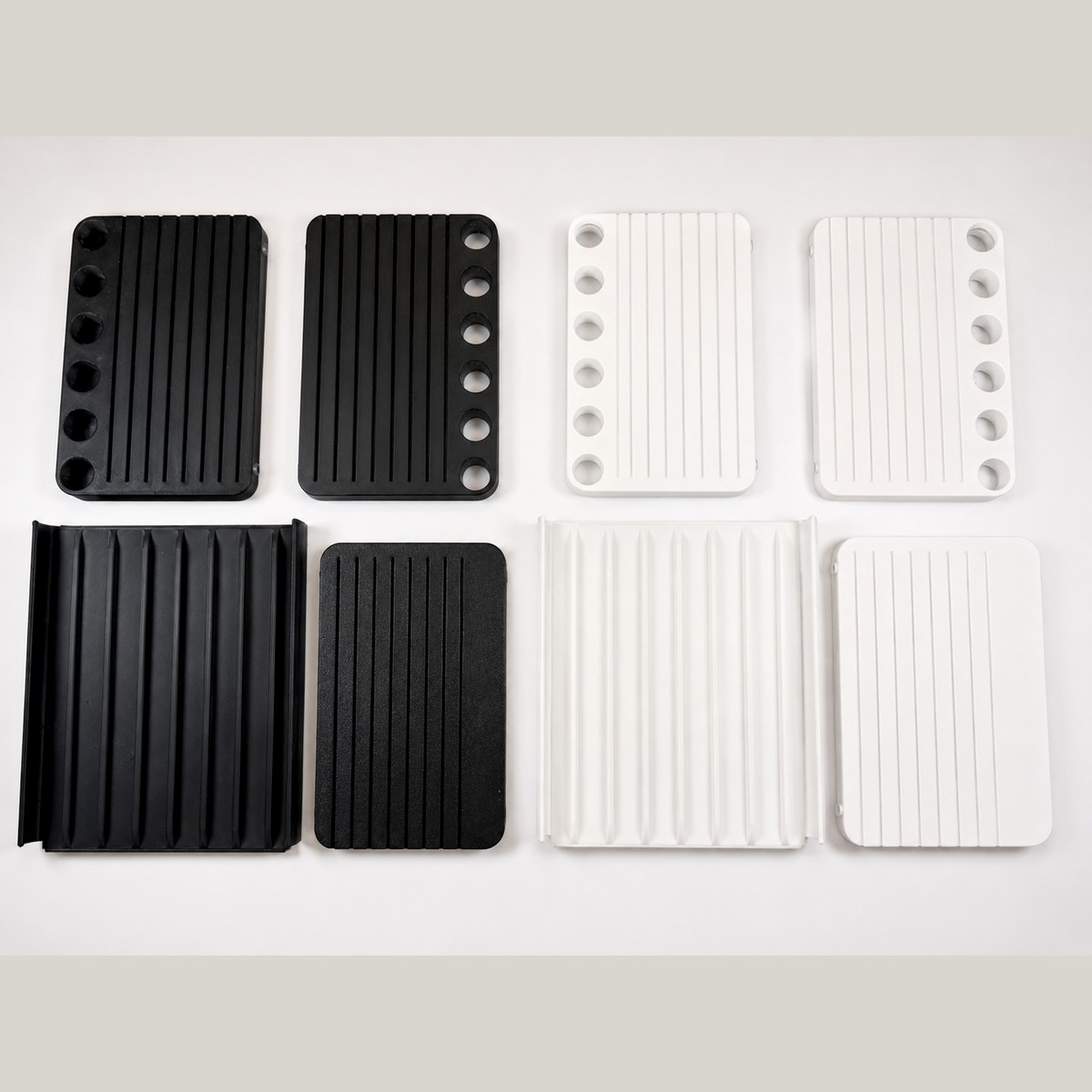 The Desk Shelf parts laid out in black and in white, legs, top covers and sub-shelves